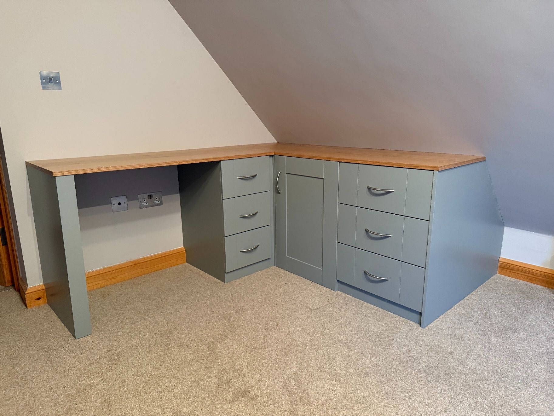 Full-length bespoke fitted desk with matched cabinetry