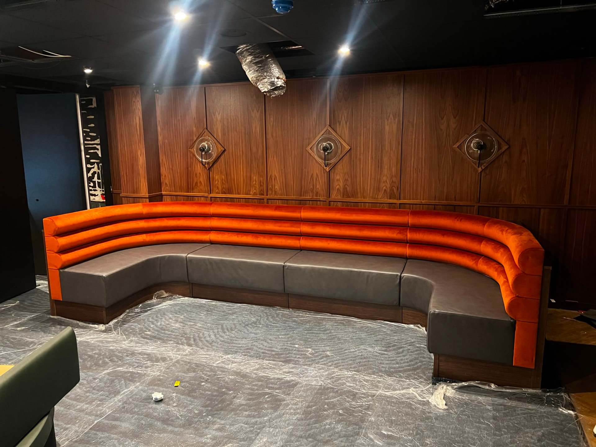 Gaucho City project by Red Kite Furniture, Gaucho City Orange Velvet Curved Banquette Walnut Panelling 01