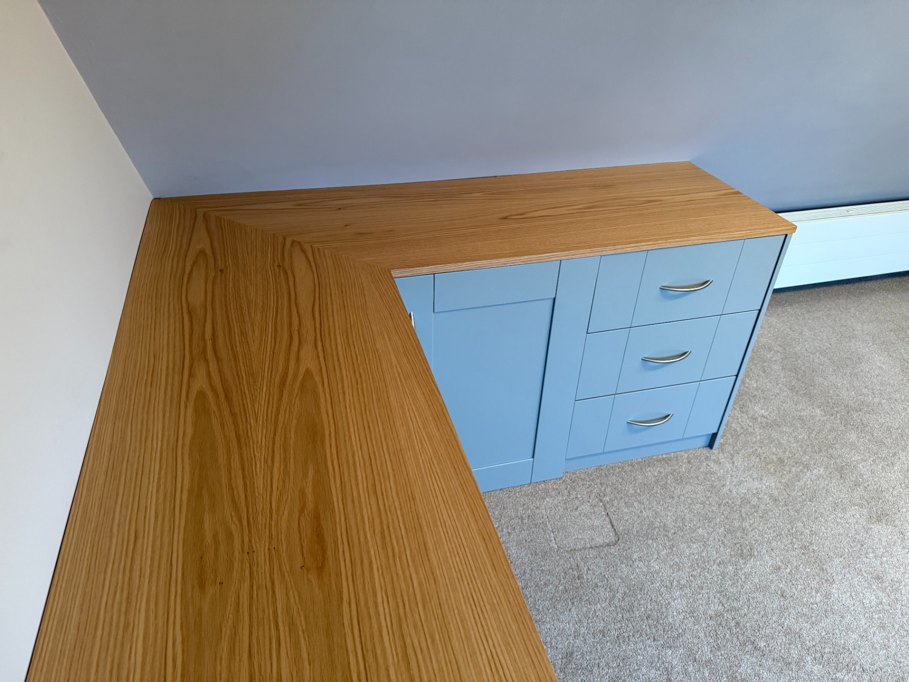 Bespoke fitted corner desk built into a home study